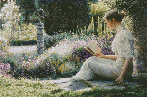 Девушка в саду читает книгу
